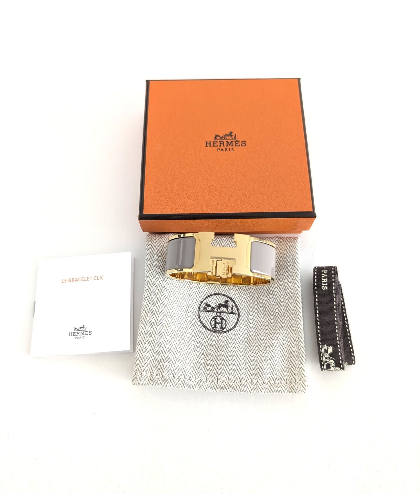 Hermes Clic Clac H bracelet in glacé brown/yellow gold
