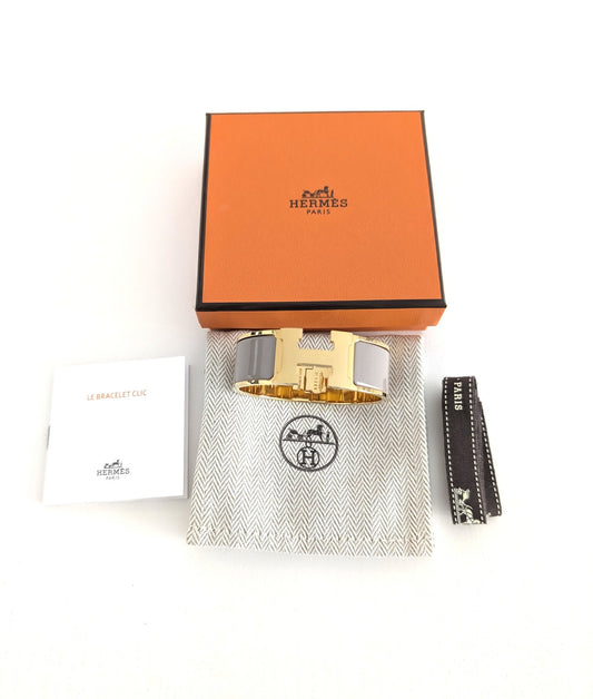 Hermes bracciale Clic Clac H marron glacé/dorato giallo