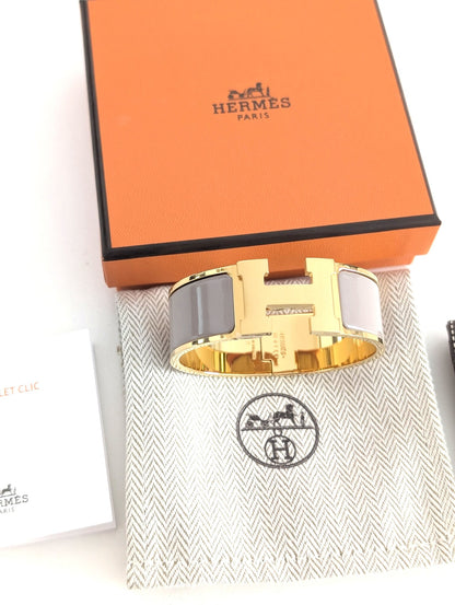 Hermes Clic Clac H bracelet in glacé brown/yellow gold