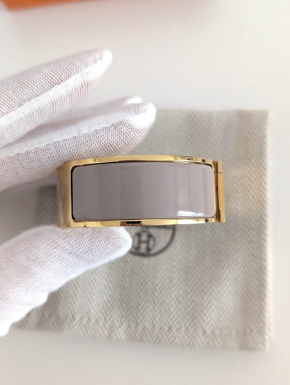 Hermes Clic Clac H bracelet in glacé brown/yellow gold