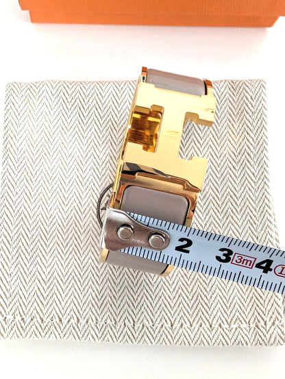 Hermes Clic Clac H bracelet in glacé brown/yellow gold