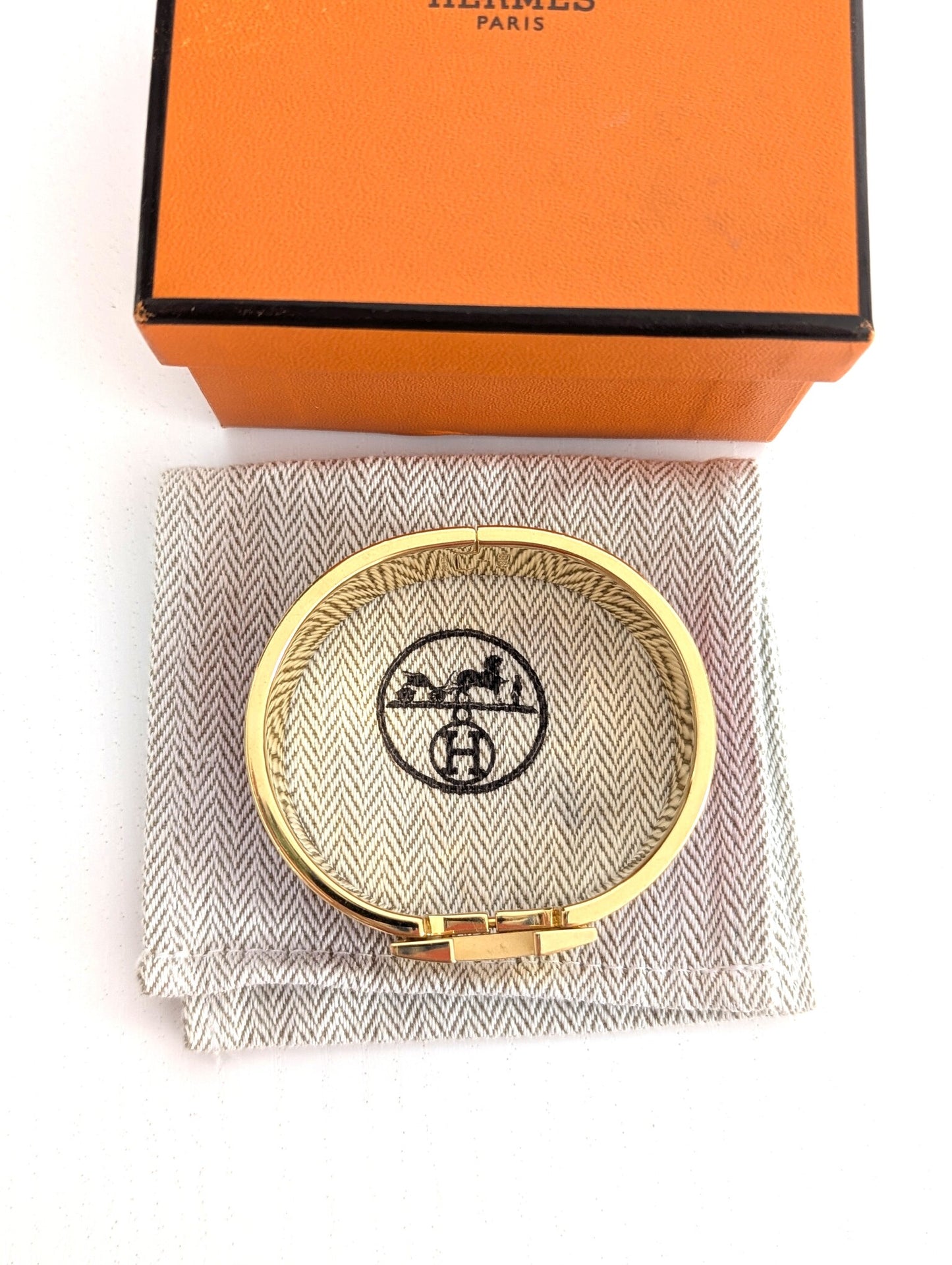 Hermes Clic Clac H bracelet in glacé brown/yellow gold