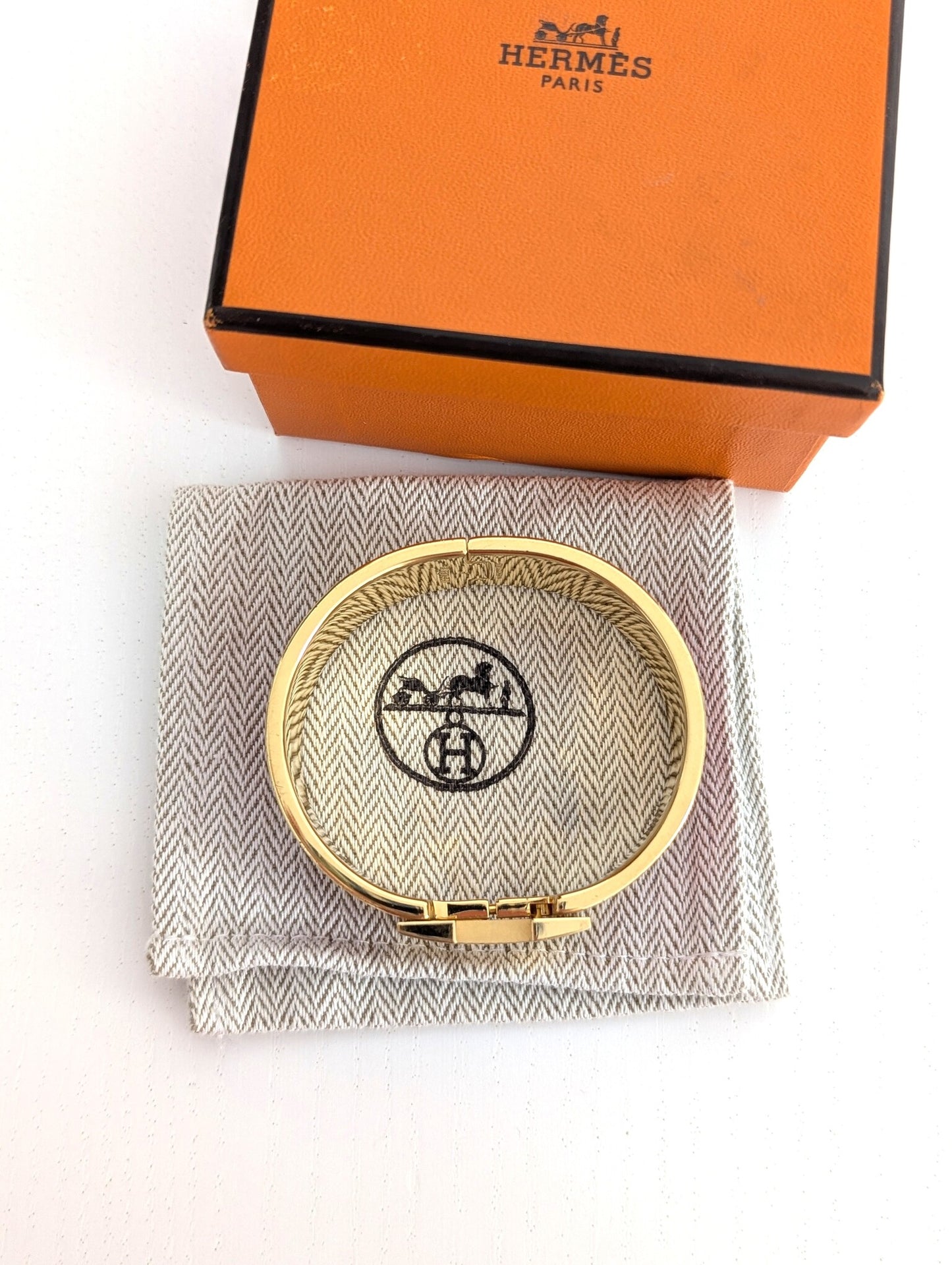 Hermes Clic Clac H bracelet in glacé brown/yellow gold