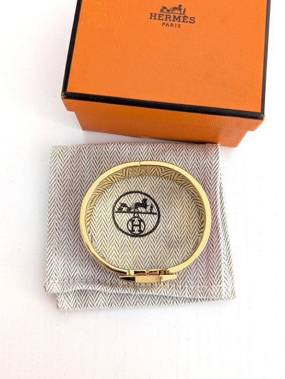 Hermes Clic Clac H bracelet in glacé brown/yellow gold