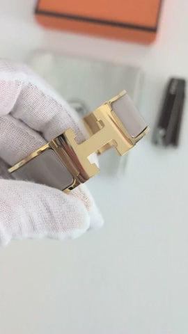 Hermes Clic Clac H bracelet in glacé brown/yellow gold